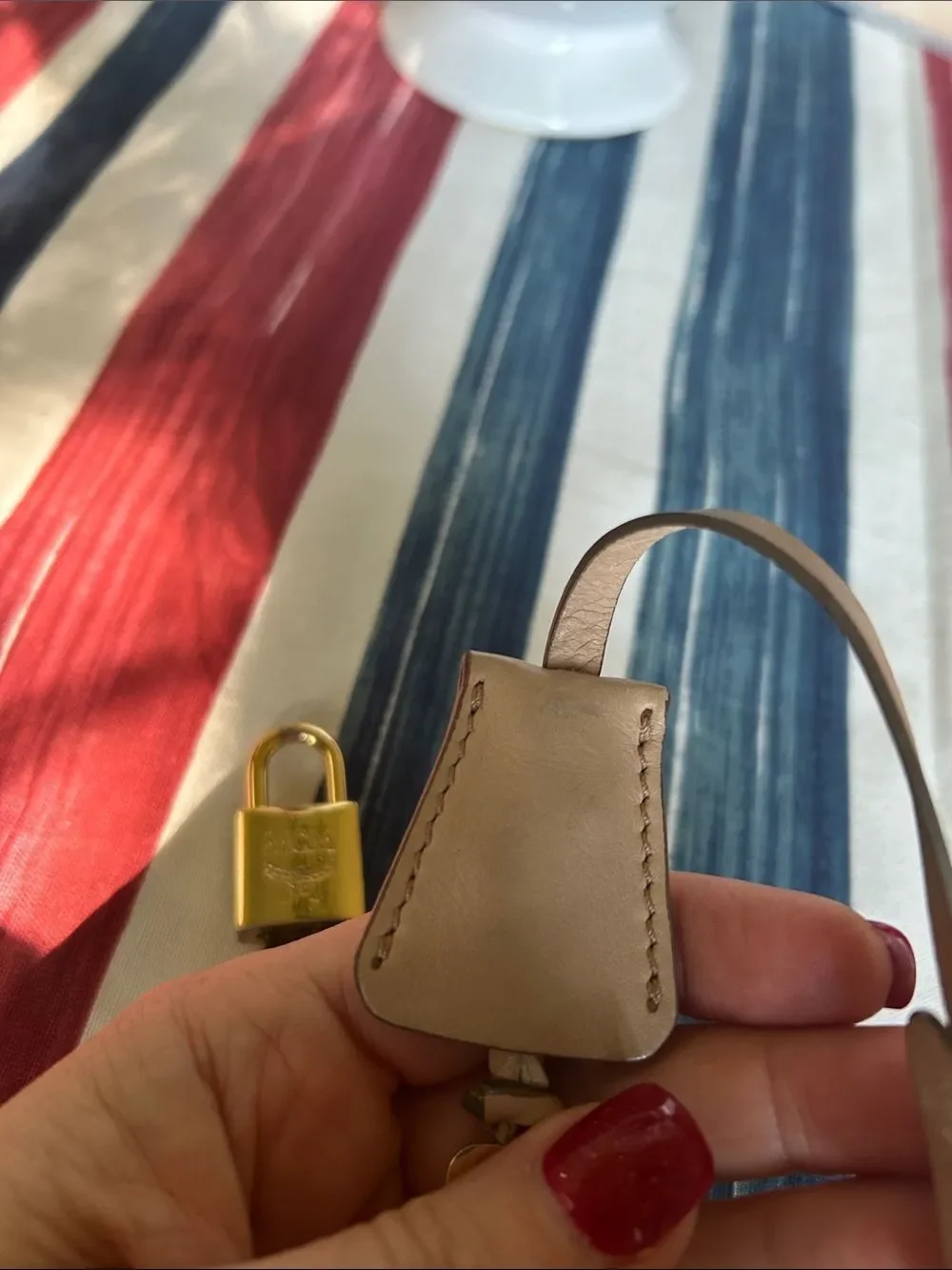 MCM jet and lock gold color with cream lanyard amazing condition